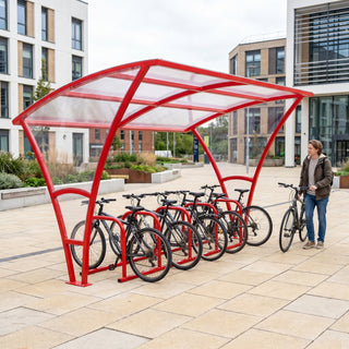 Armstrong 10 cycle bike shelter in Traffic Red installed on a university campus with bicycles parked