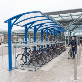 Rydale cantilever two-tier 80 bike shelter in Traffic Blue at a railway station