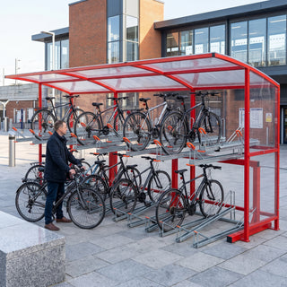 Rydale Minor two tier 30 bike shelter in RAL 3020 Traffic Red at a railway station