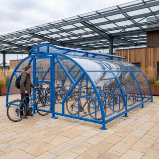 20 cycle Salisbury closed compound bike shelter with vented roof in RAL 5017 Traffic Blue at a railway station
