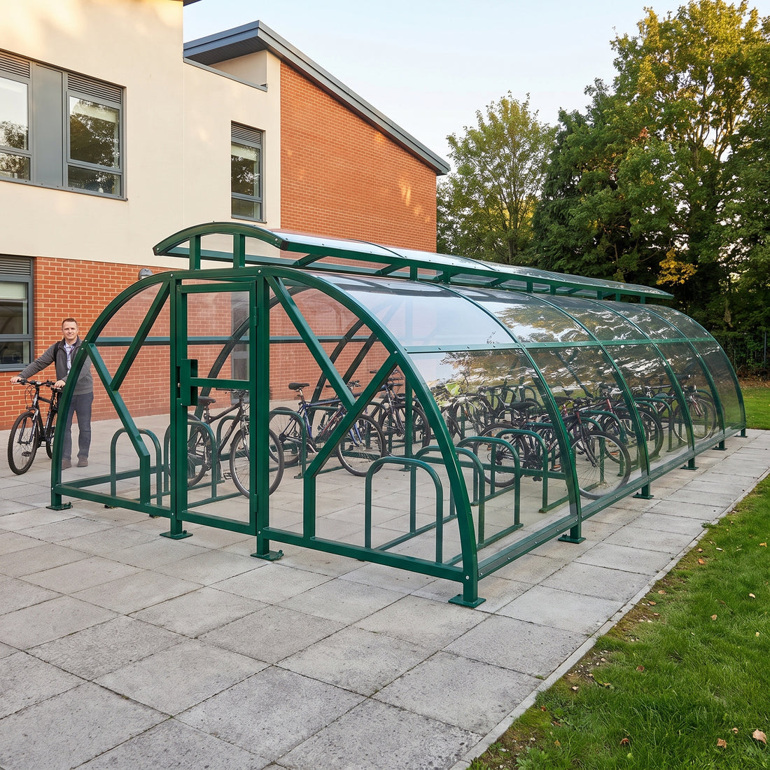 48 cycle Salisbury closed compound bike shelter with vented roof in RAL 6005 Moss Green at a school