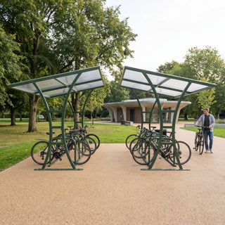 Double-sided 20 bike shelter in moss green at a public park entrance