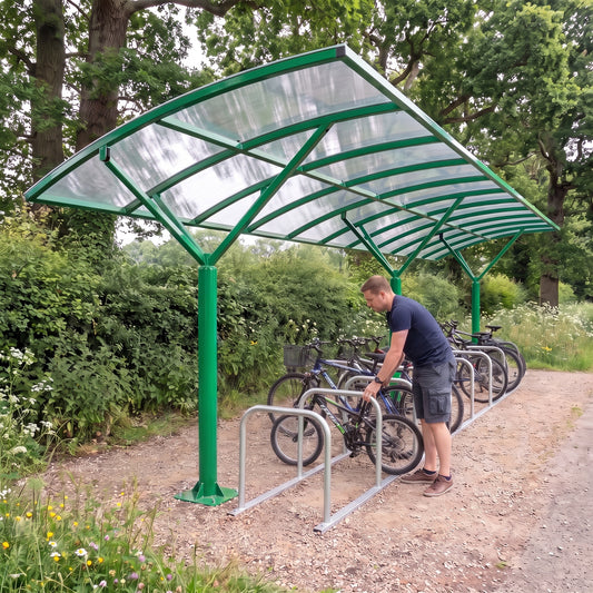 Welbeck WE20 cycle shelter in RAL 6024 Traffic Green - cyclist parking bike in park