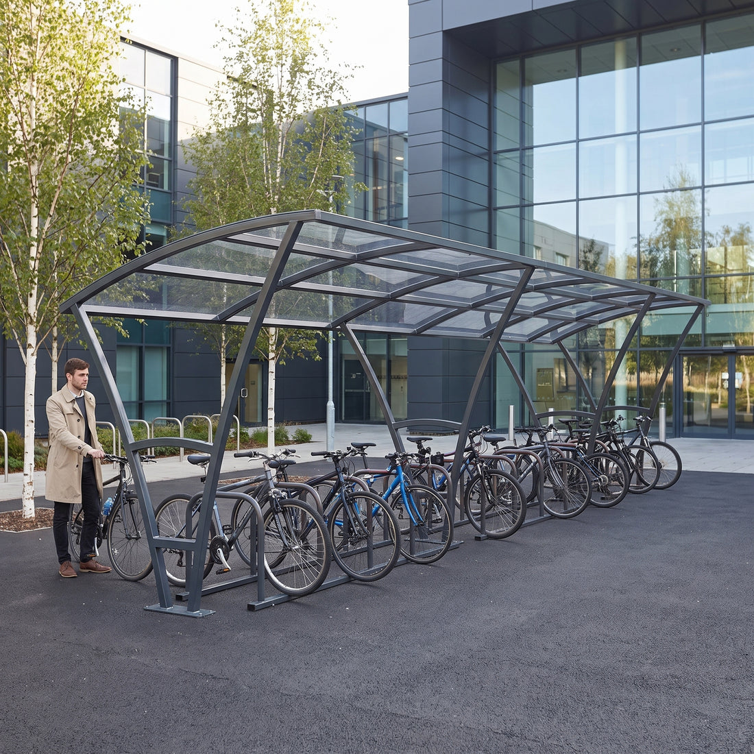 Armstrong 24 cycle bike shelter in Anthracite Grey at a modern business school campus with bicycles parked