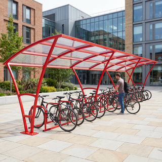 Armstrong 30 cycle bike shelter in Traffic Red installed on a university campus with bicycles parked