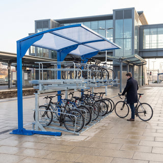 Rydale cantilever two-tier 20 bike shelter in Signal Blue at a railway station