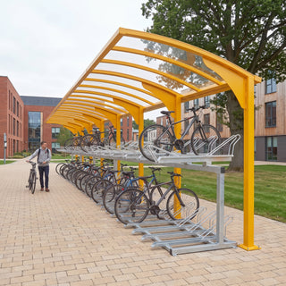 Rydale cantilever two-tier 60 bike shelter in Traffic Yellow at a university campus