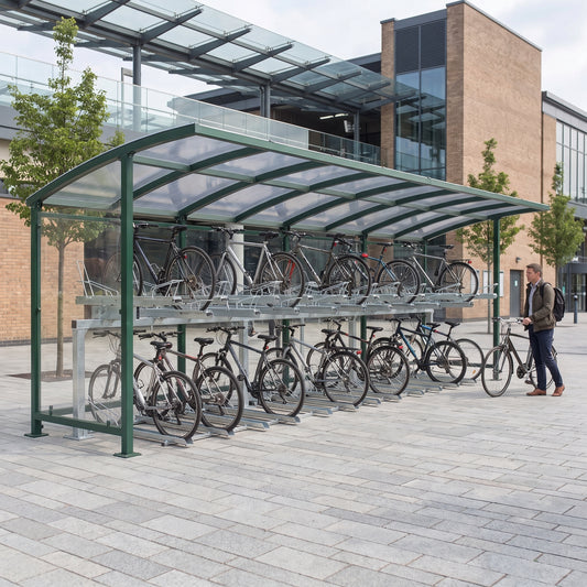 Rydale Minor two tier 50 bike shelter in RAL 6005 Moss Green at a railway station