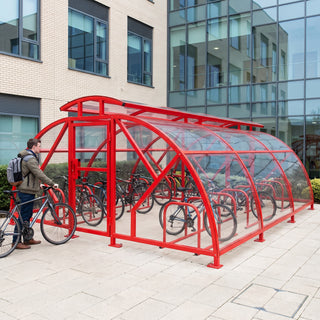 20 cycle Salisbury closed compound bike shelter with vented roof in red at a hospital