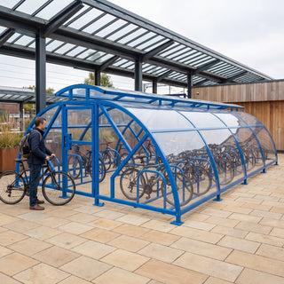 40 cycle Salisbury closed compound bike shelter with vented roof in RAL 5017 Traffic Blue at a railway station