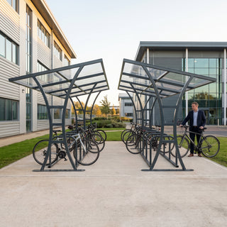 Double-sided 28 bike shelter in anthracite grey at an industrial office campus
