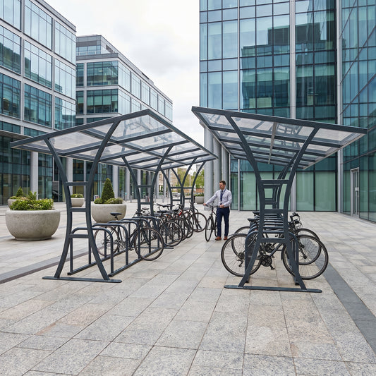 Tavistock Double 48 bike shelter in Anthracite Grey at a business park plaza