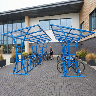 Tavistock Double 60 bike shelter in Traffic Blue at a sports and leisure centre