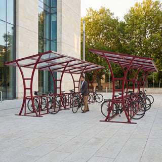 Tavistock Double 60 bike shelter in Wine Red at a civic centre square